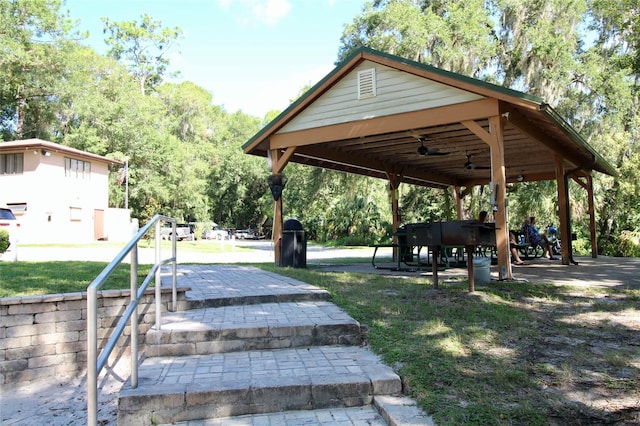 view of home's community featuring a patio area and a yard