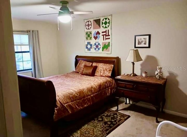 bedroom featuring ceiling fan and carpet floors