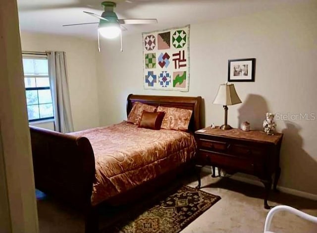 bedroom featuring a ceiling fan and baseboards