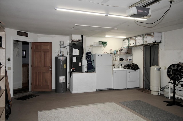 garage with heating unit, electric water heater, white fridge, separate washer and dryer, and a garage door opener