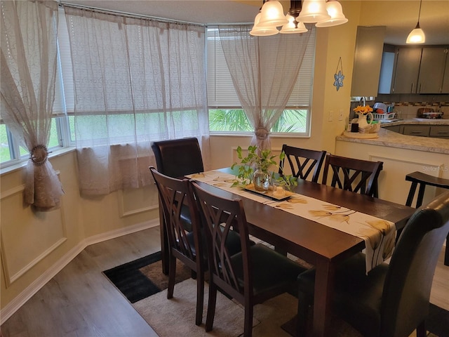 dining area with hardwood / wood-style flooring and a wealth of natural light