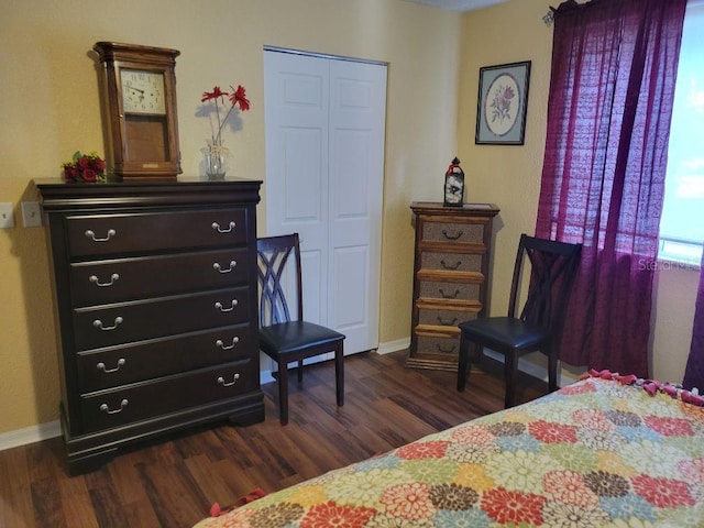 bedroom with a closet and dark hardwood / wood-style floors