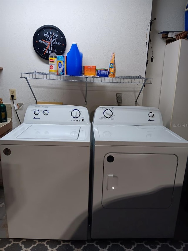 clothes washing area with independent washer and dryer