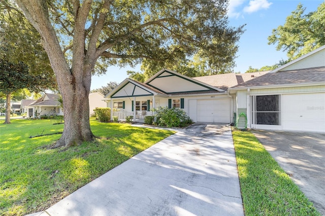 single story home with a garage, a front yard, and a porch