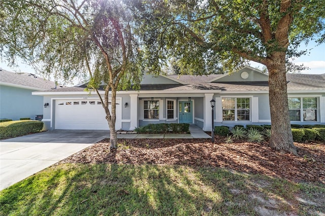 single story home with a garage and covered porch