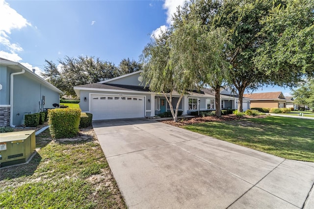 single story home with a garage and a front yard