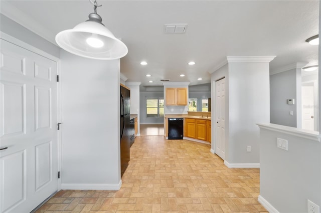 kitchen featuring black appliances, pendant lighting, and ornamental molding