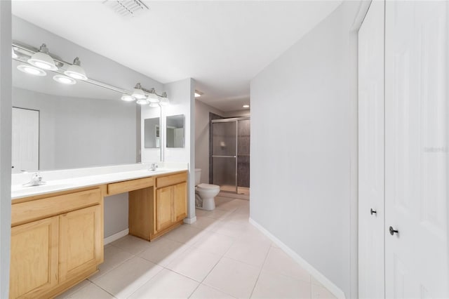 bathroom featuring tile patterned floors, walk in shower, toilet, and vanity