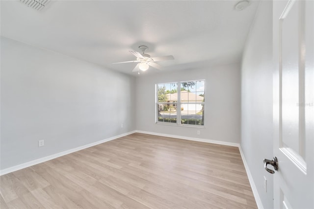 spare room with ceiling fan and light hardwood / wood-style flooring