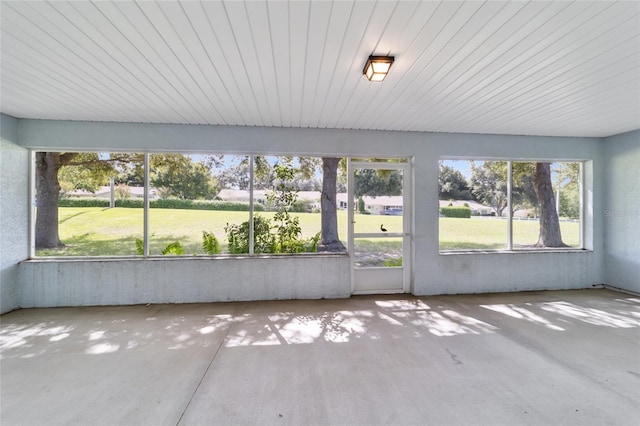 unfurnished sunroom with a wealth of natural light