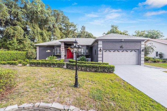 single story home featuring a garage and a front yard