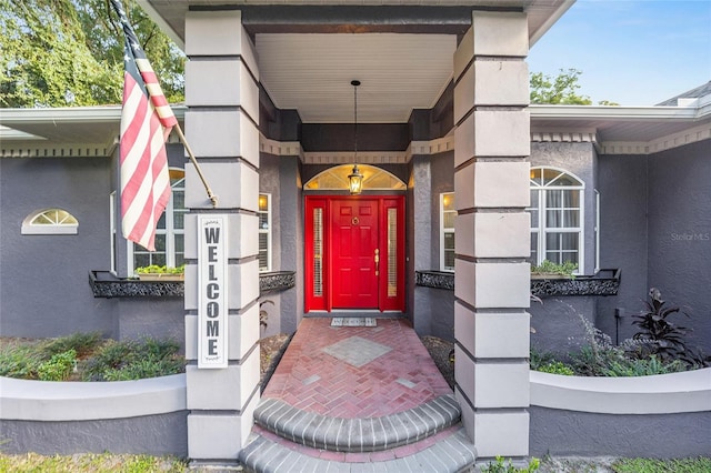 entrance to property featuring a porch