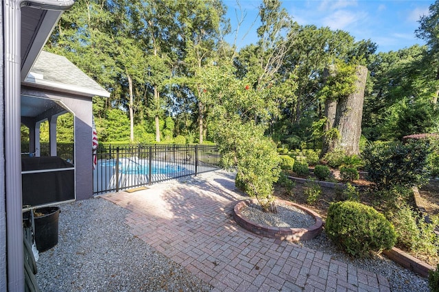 view of patio with a fenced in pool