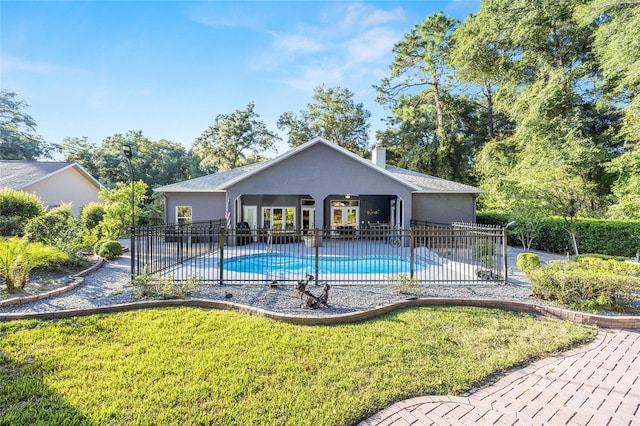 view of swimming pool with a yard and a patio area