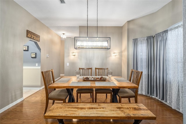 dining area featuring dark hardwood / wood-style flooring