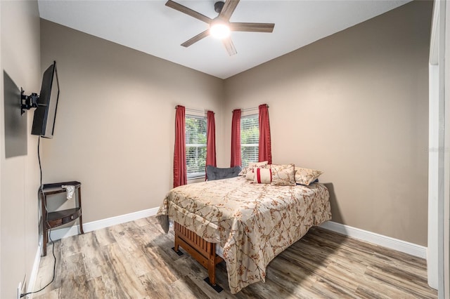 bedroom featuring wood-type flooring and ceiling fan