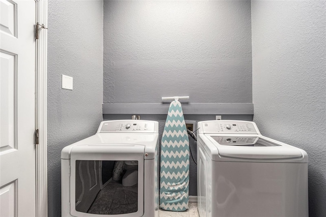 laundry room with independent washer and dryer