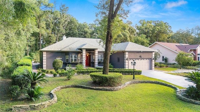 single story home featuring a front lawn and a garage