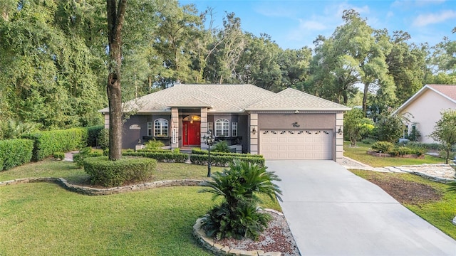 ranch-style house featuring a garage and a front yard