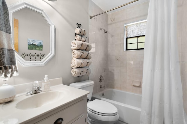 full bathroom with vanity, shower / tub combo, and toilet