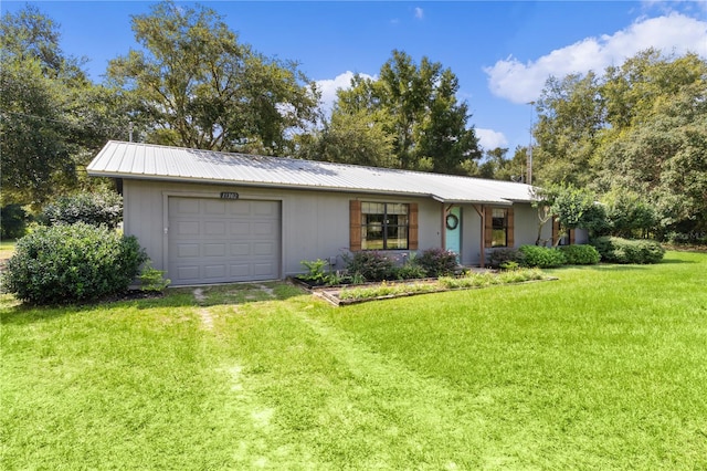 ranch-style house featuring a garage and a front lawn