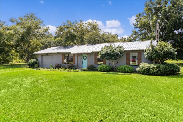 ranch-style home with a front yard and a garage