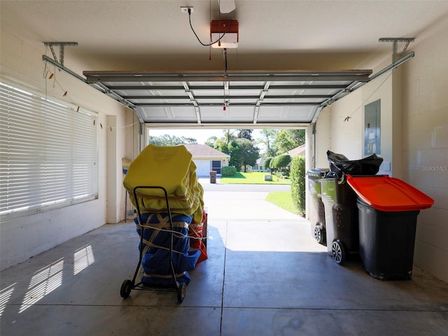 garage featuring a garage door opener and electric panel