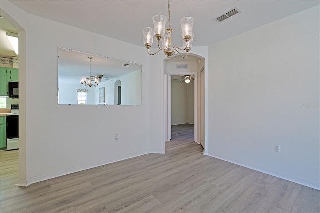 unfurnished dining area with ceiling fan and light wood-type flooring