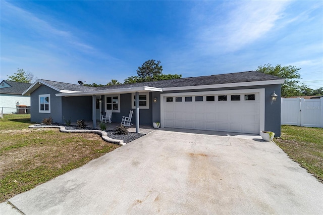 single story home featuring an attached garage, concrete driveway, stucco siding, covered porch, and a gate