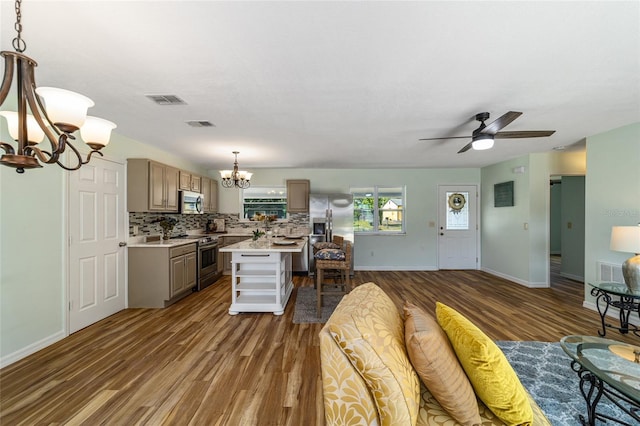 living room with a chandelier, wood finished floors, ceiling fan, and baseboards
