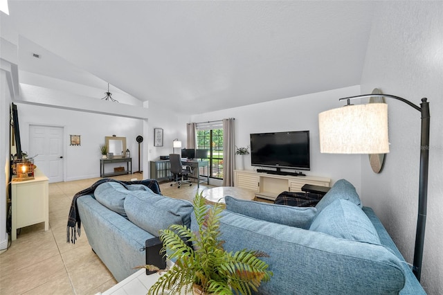 living room with lofted ceiling and light tile patterned floors