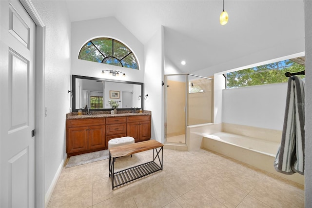 bathroom with tile patterned floors, vanity, plus walk in shower, and high vaulted ceiling