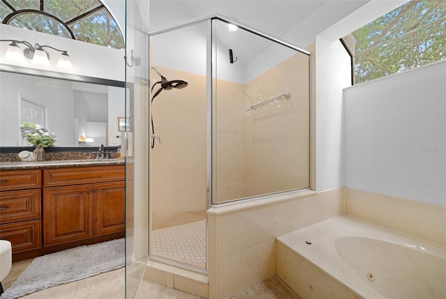 bathroom featuring separate shower and tub, tile patterned floors, and vanity