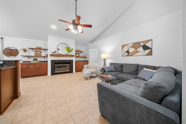 living room featuring light tile patterned floors, high vaulted ceiling, and ceiling fan