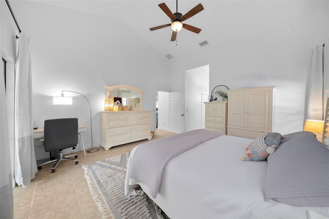 bedroom with ceiling fan, light tile patterned flooring, and high vaulted ceiling