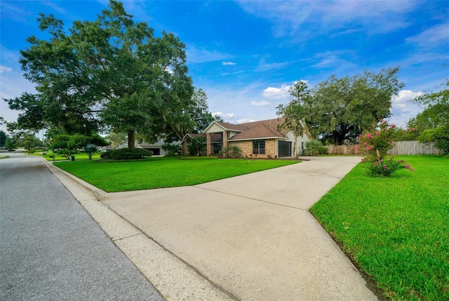 view of front facade with a front yard and a garage