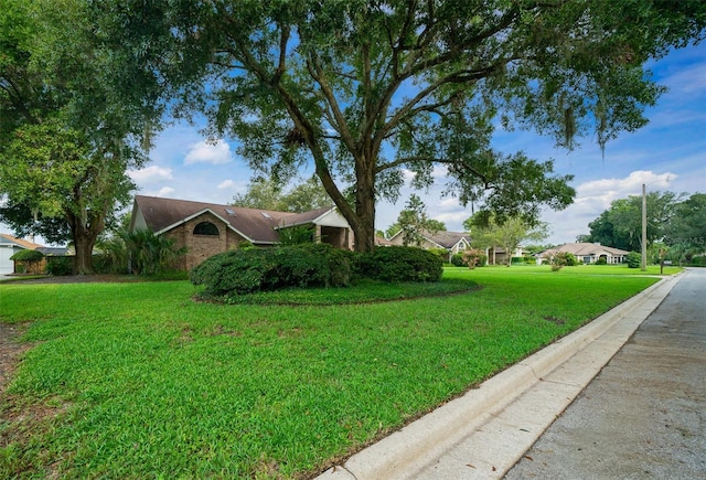 exterior space featuring a front lawn