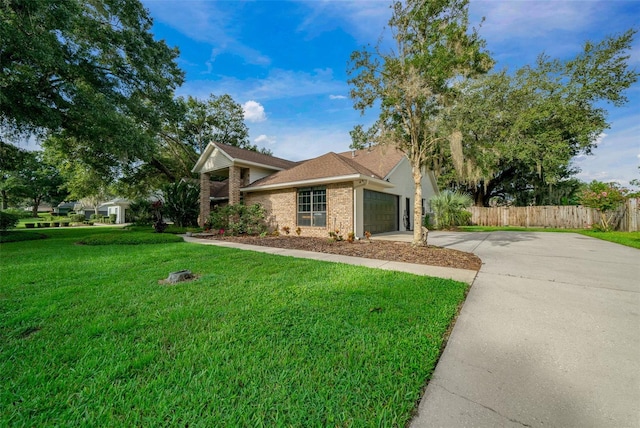 ranch-style home with a garage and a front lawn