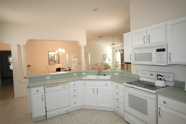 kitchen featuring ceiling fan with notable chandelier, white appliances, white cabinets, and sink