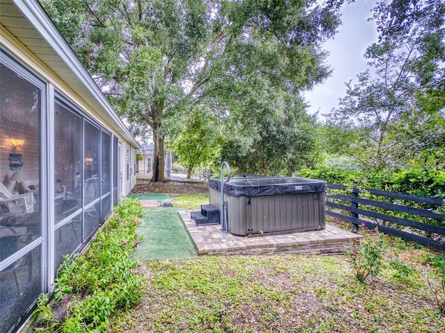 view of yard with a hot tub