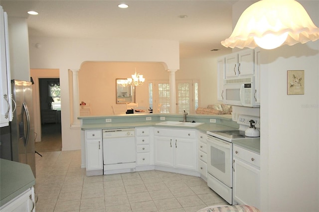 kitchen with white cabinetry, sink, a healthy amount of sunlight, and white appliances