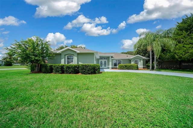 ranch-style home with a front lawn