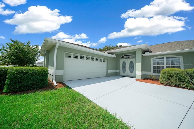 ranch-style home featuring a garage and a front yard