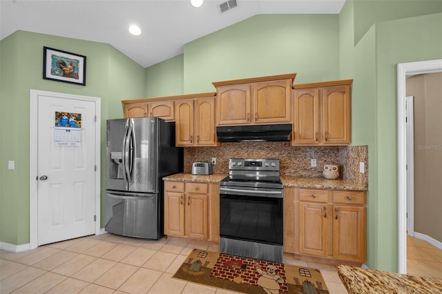 kitchen with appliances with stainless steel finishes, light stone counters, tasteful backsplash, and vaulted ceiling