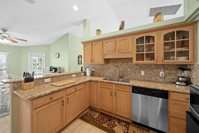 kitchen with dishwasher, kitchen peninsula, and sink