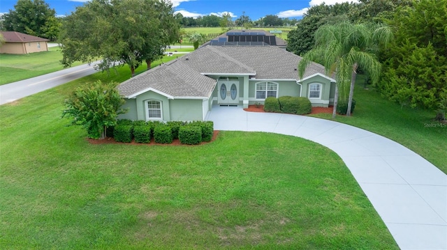 ranch-style home with a front yard