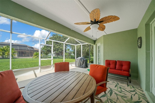 sunroom / solarium with vaulted ceiling and ceiling fan