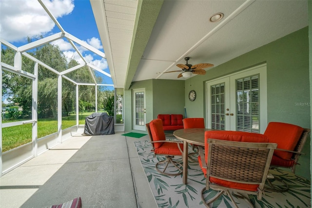 view of patio / terrace with a grill, ceiling fan, glass enclosure, and french doors