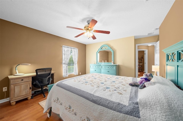 bedroom featuring light hardwood / wood-style flooring and ceiling fan