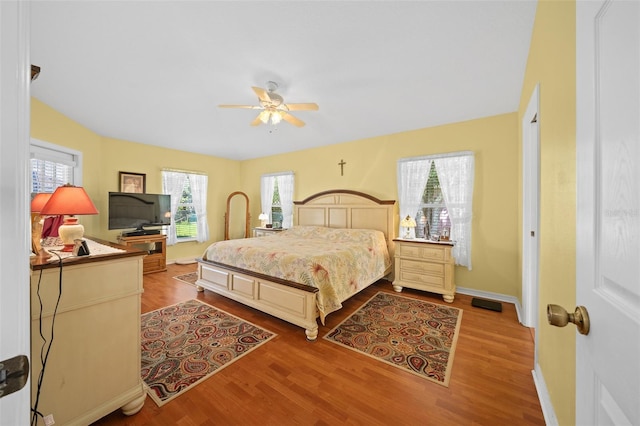 bedroom featuring ceiling fan and hardwood / wood-style flooring